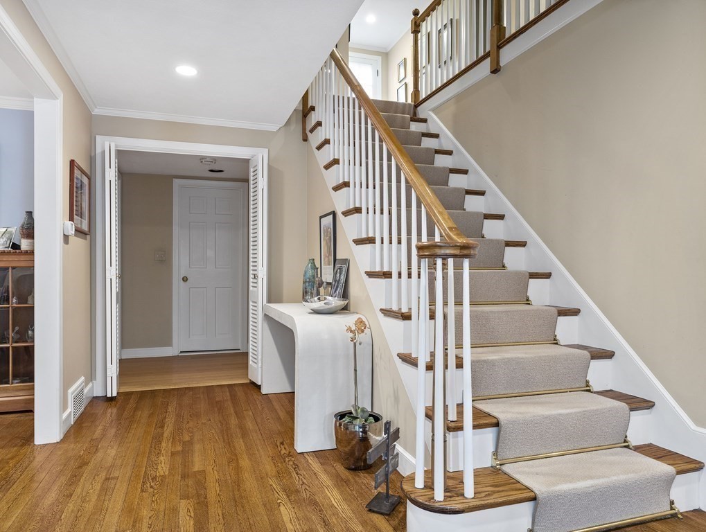 177 Hampshire Road Wellesley, MA 02481 - Photo 3 of 15 a view of entryway with wooden floor and front door