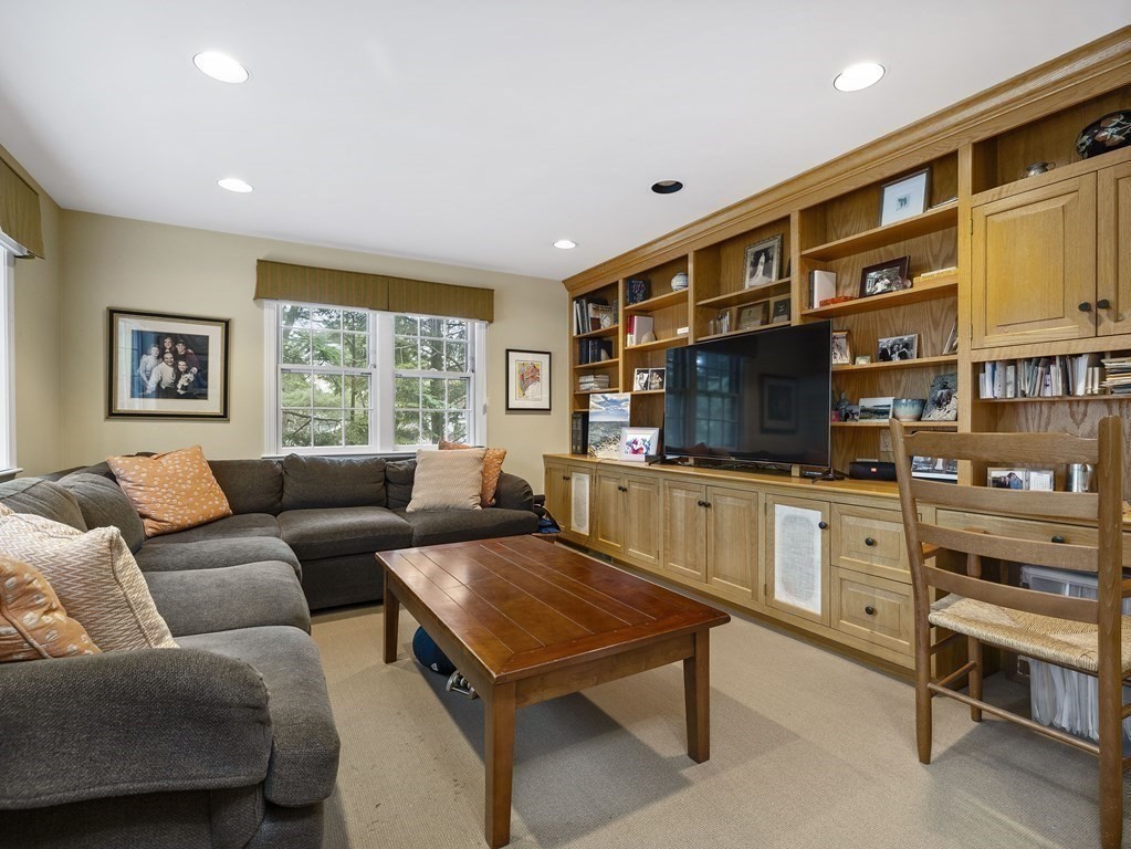 177 Hampshire Road Wellesley, MA 02481 - Photo 8 of 15 a living room with furniture and a flat screen tv