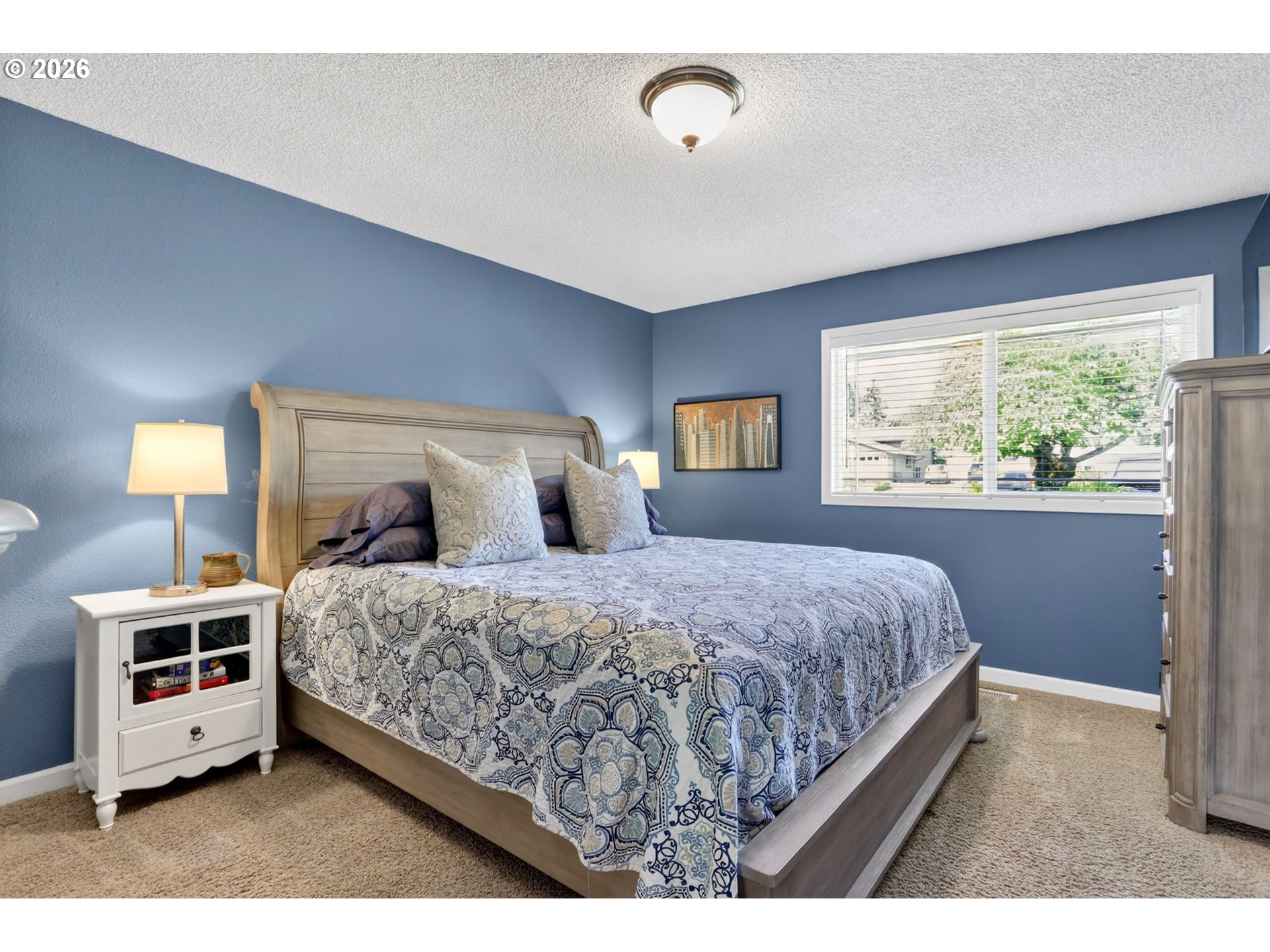 1776 Southeast 114th Place Portland, OR 97216 - Photo 29 of 47 a bedroom with a large bed and a window