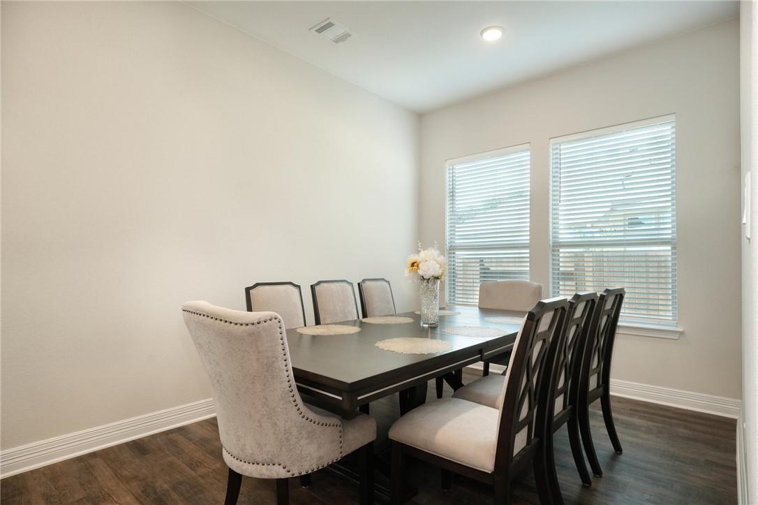 229 Bonnet Boulevard Georgetown, TX 78628 - Photo 6 of 20 Dining space with baseboards and dark wood-style flooring
