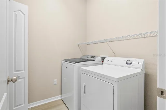 a utility room with dryer and washer