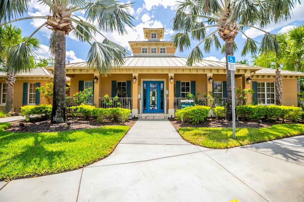 11790 Fennemore Way Parrish, FL 34219 - Photo 23 of 41 front view of a house with a yard and palm trees
