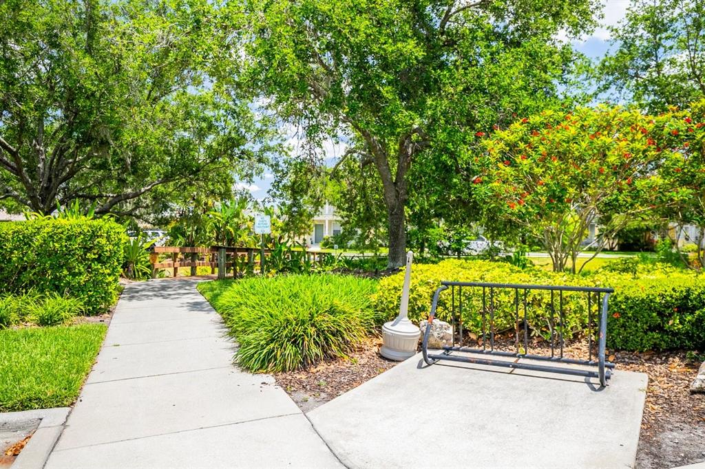 11790 Fennemore Way Parrish, FL 34219 - Photo 25 of 41 a view of a patio with a table and chairs under an umbrella