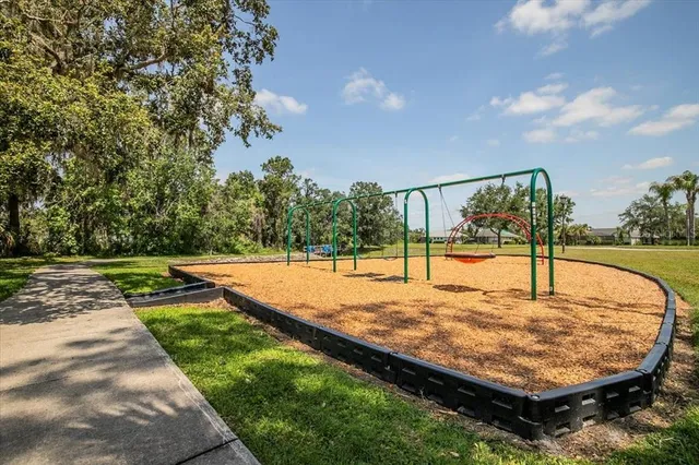 a view of a park with large trees