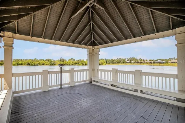 a view of wooden floor and a lake view