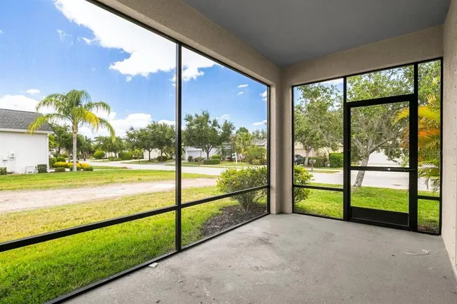 an aerial view of residential houses with outdoor space and swimming pool