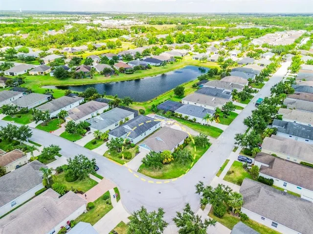 an aerial view of residential houses with outdoor space