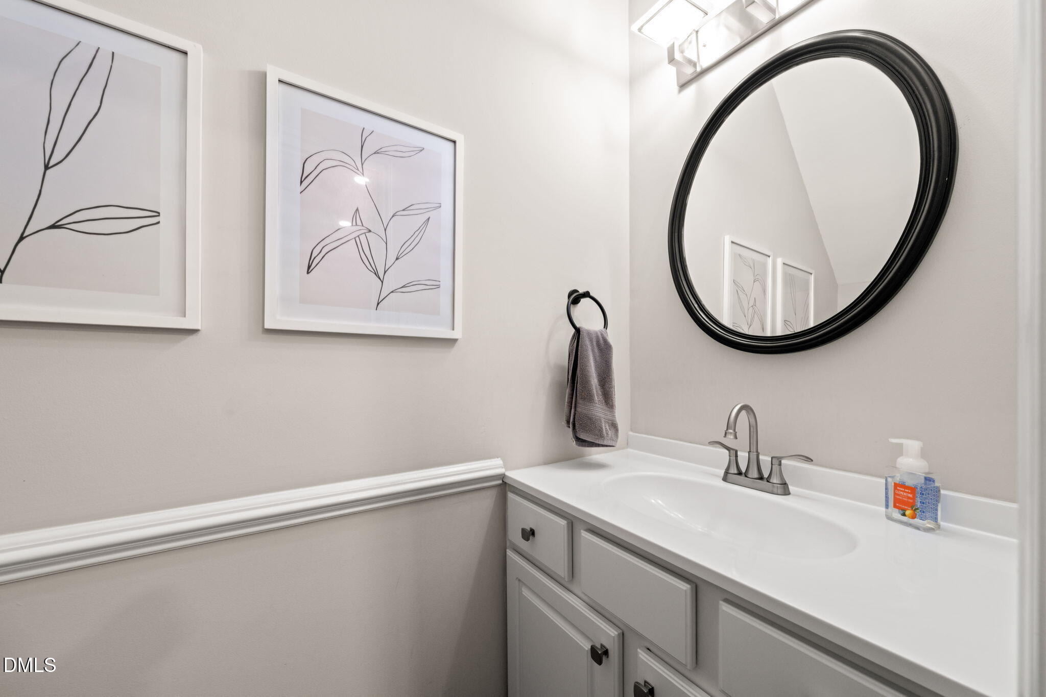 4323 Pine Springs Court Raleigh, NC 27613 - Photo 15 of 38 a bathroom with a sink and a mirror