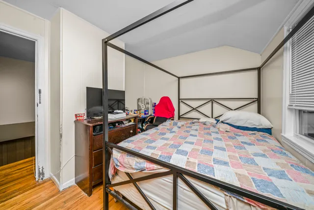 a very nice looking room with a dining table chairs and a refrigerator