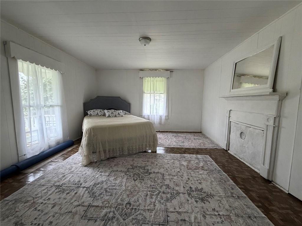 209 Old Perry Road Marshallville, GA 31057 - Photo 3 of 40 a bedroom with a bed and a window