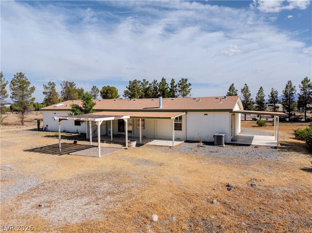 1890 West Dyer Road Pahrump, NV 89048 - Photo 12 of 40 This spacious property offers a serene retreat with expansive outdoor living areas.
