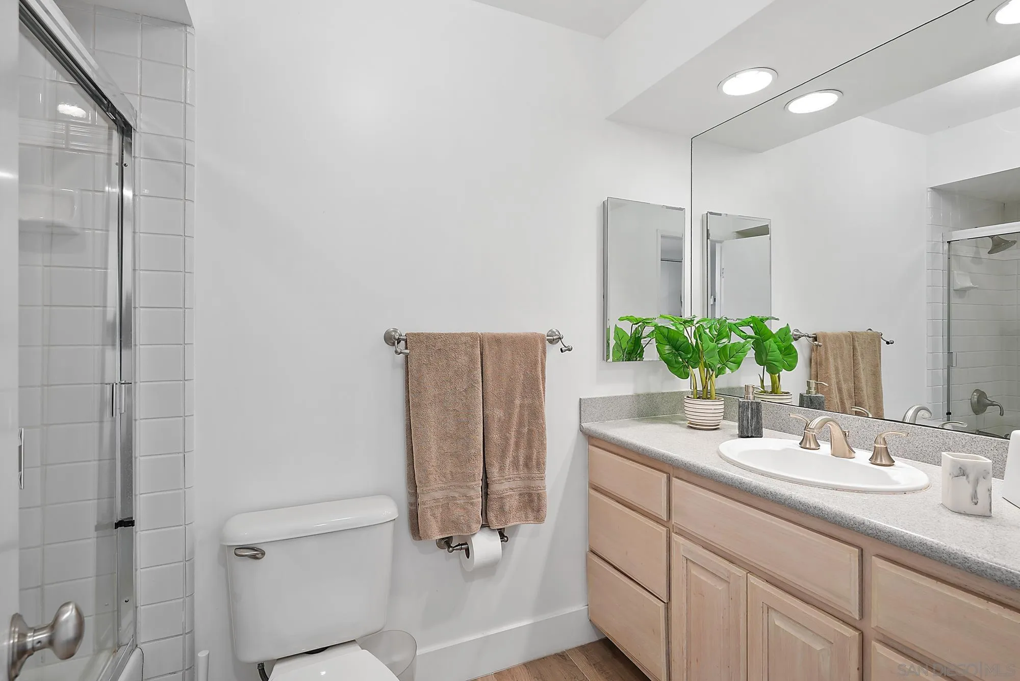 1720 Avenida Del Mundo, Unit 208 Coronado, CA 92118 - Photo 24 of 42 a bathroom with a double vanity sink and mirror