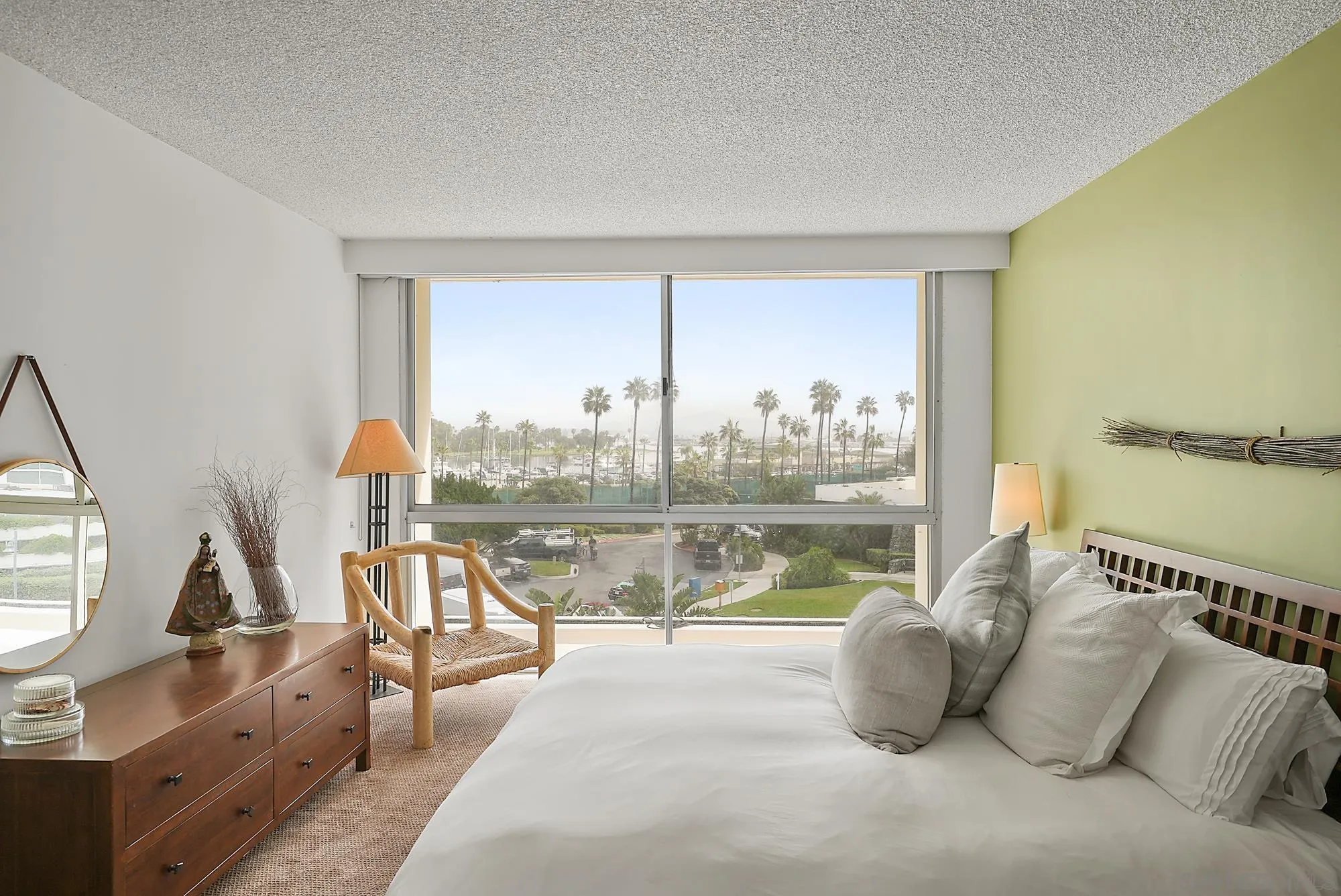 1720 Avenida Del Mundo, Unit 208 Coronado, CA 92118 - Photo 33 of 42 a view of a lake from a living room