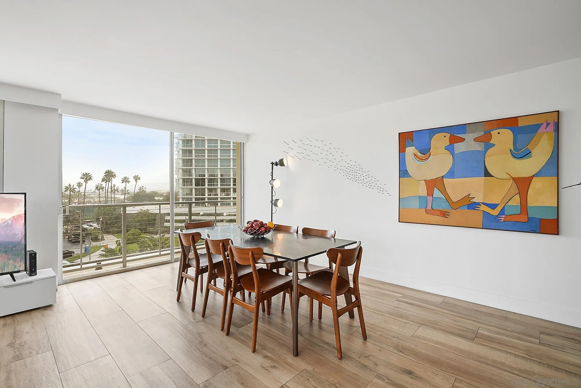 1720 Avenida Del Mundo, Unit 208 Coronado, CA 92118 - Photo 8 of 42 a view of a dining room with furniture window and wooden floor