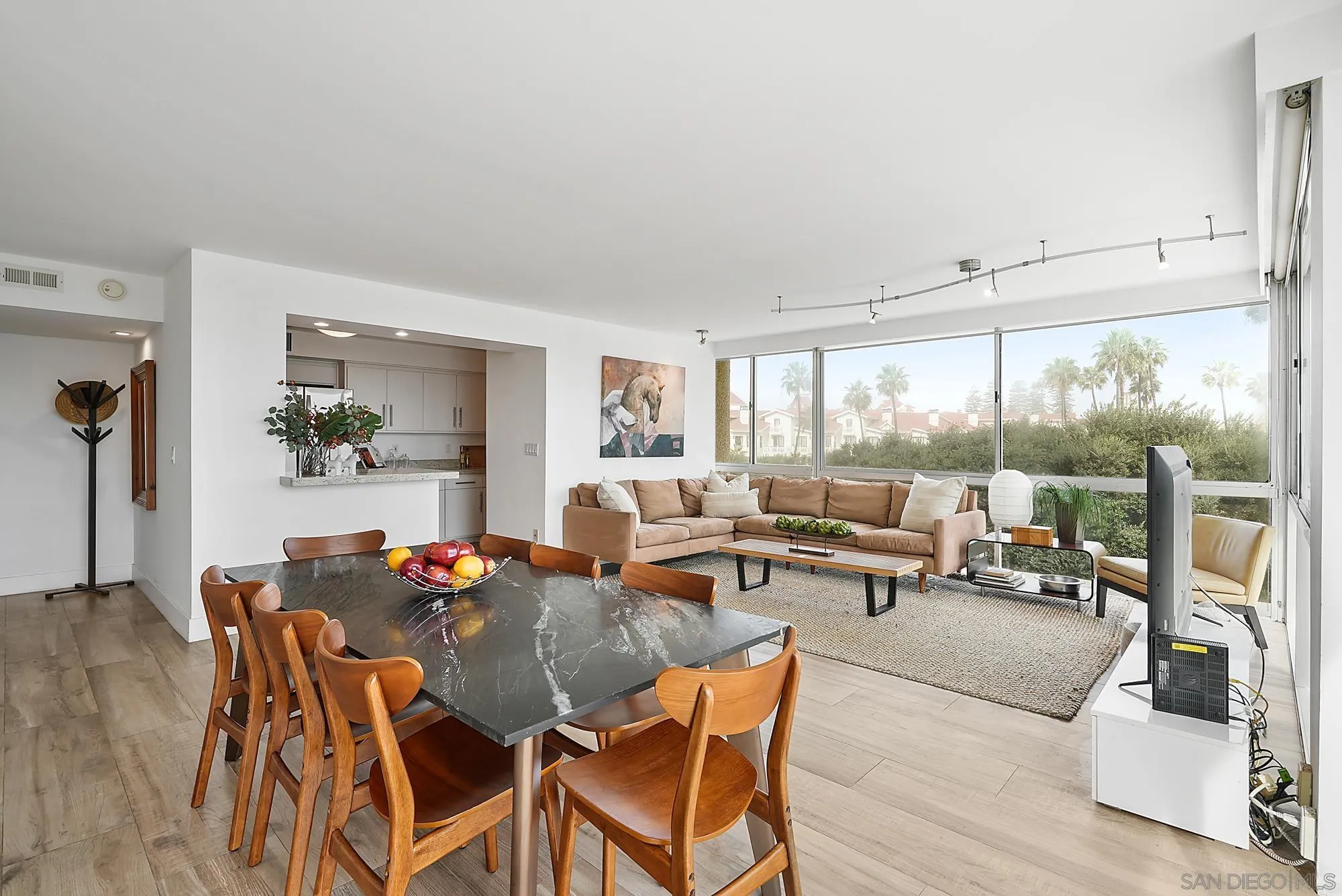 1720 Avenida Del Mundo, Unit 208 Coronado, CA 92118 - Photo 10 of 42 a living room with furniture and a large window