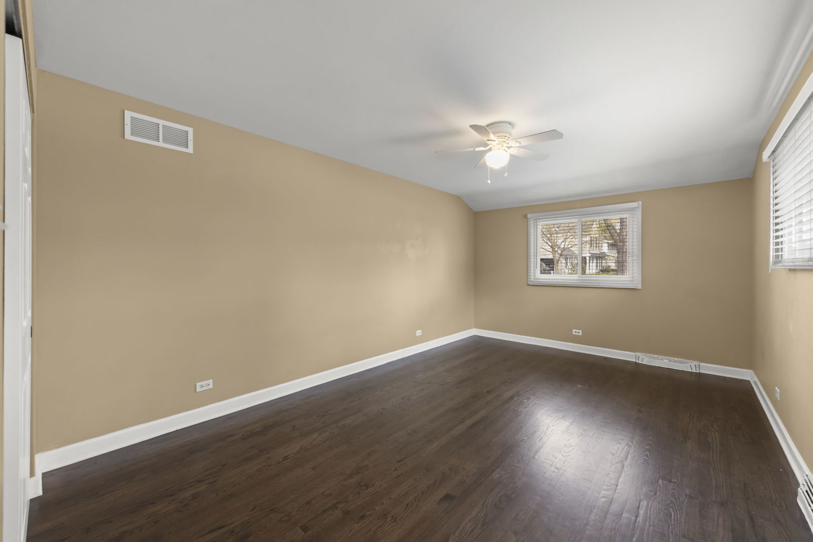5818 Ridgewood Drive Western Springs, IL 60558 - Photo 16 of 25 wooden floor in an empty room with a window