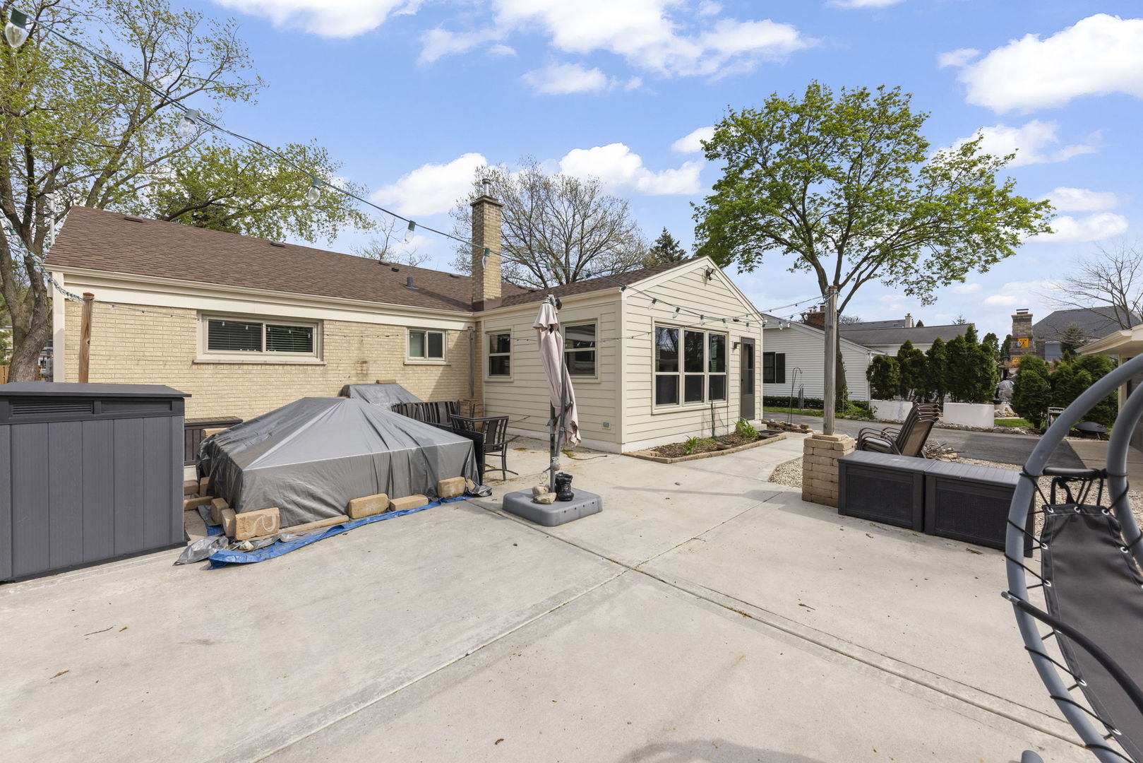 5818 Ridgewood Drive Western Springs, IL 60558 - Photo 22 of 25 a view of a white house with a patio