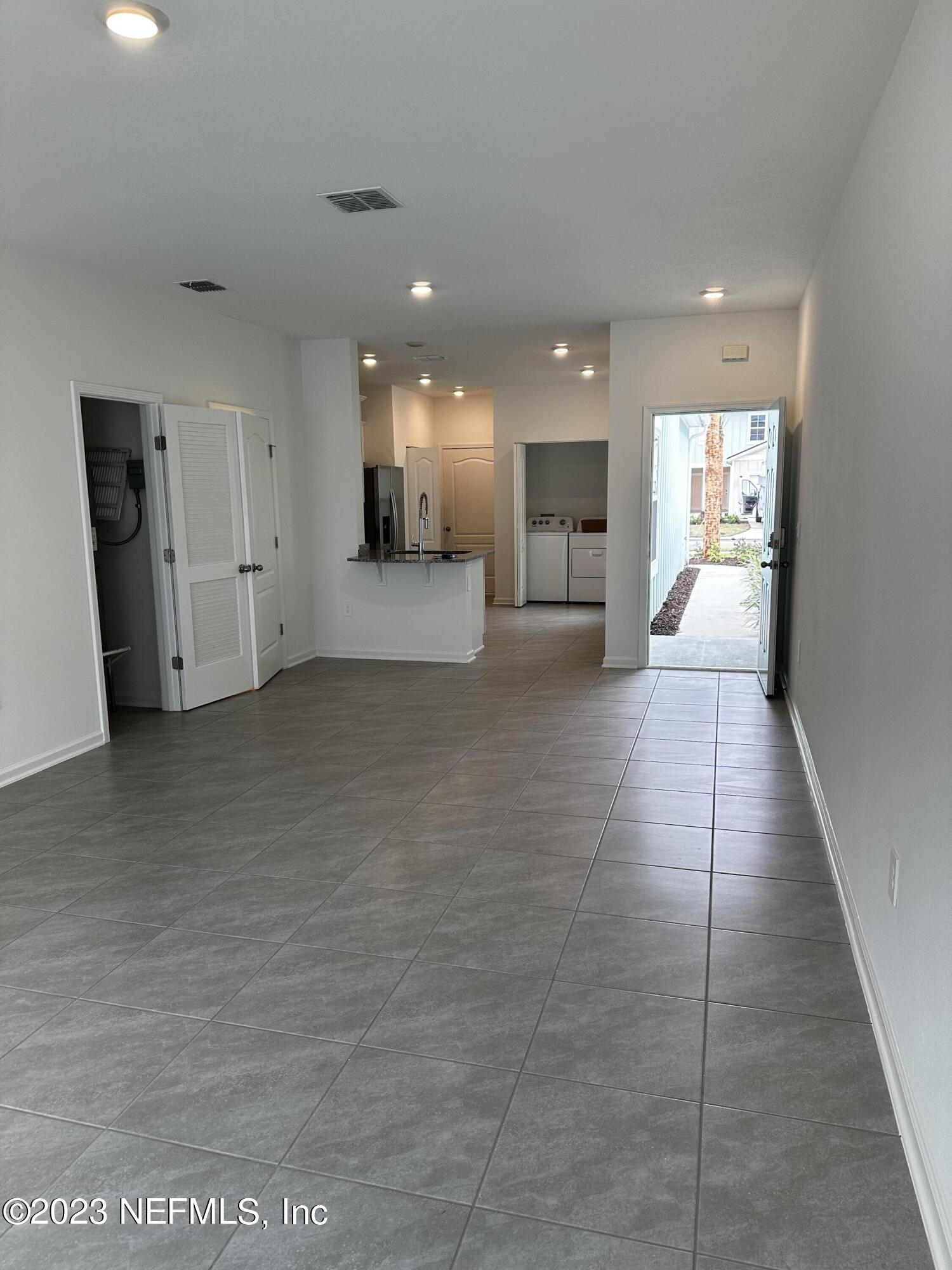 409 Talulla Trail St. Augustine, FL 32095 - Photo 18 of 58 a view of a big room with kitchen view and a window