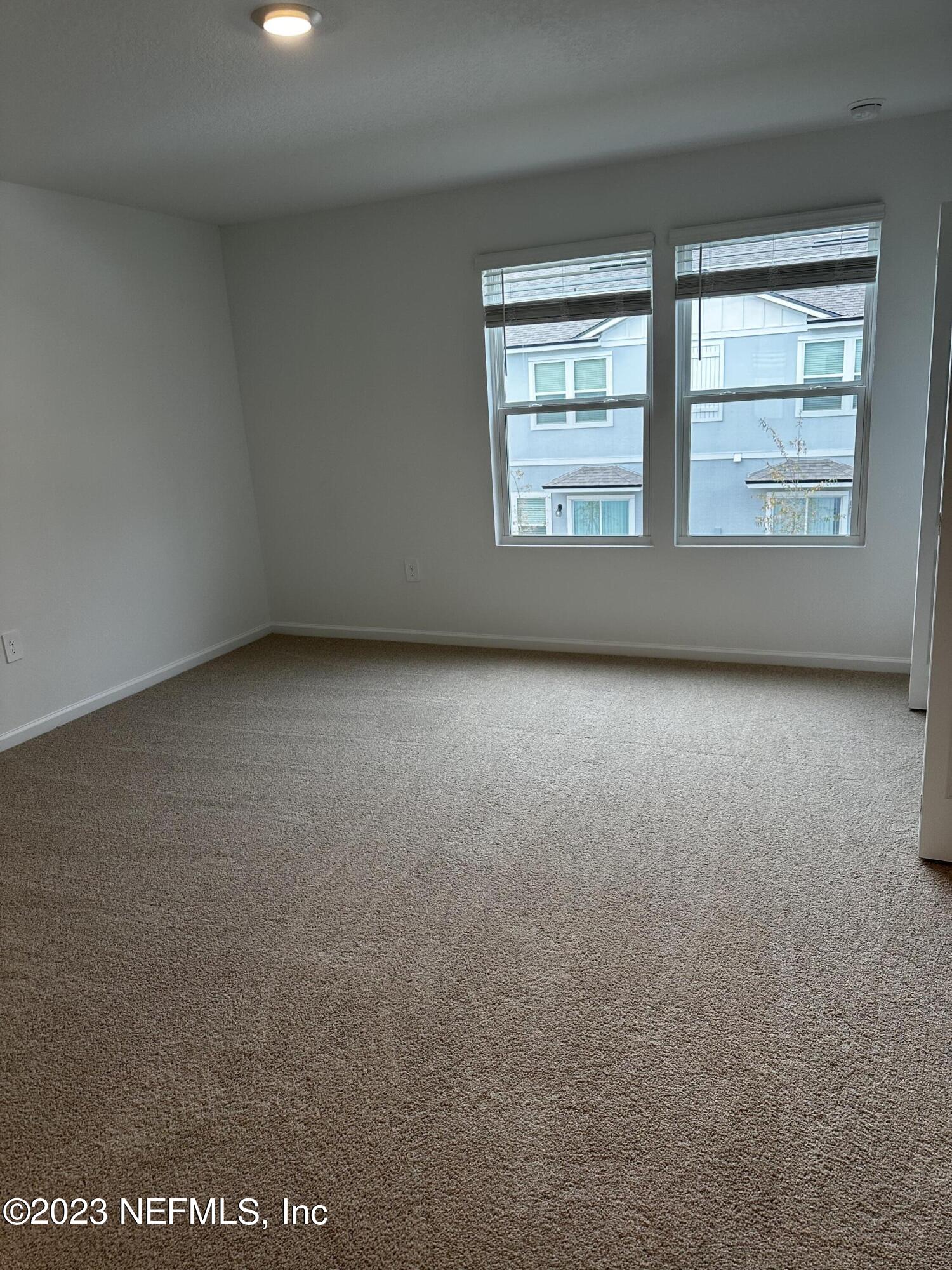 409 Talulla Trail St. Augustine, FL 32095 - Photo 39 of 58 an empty room with windows