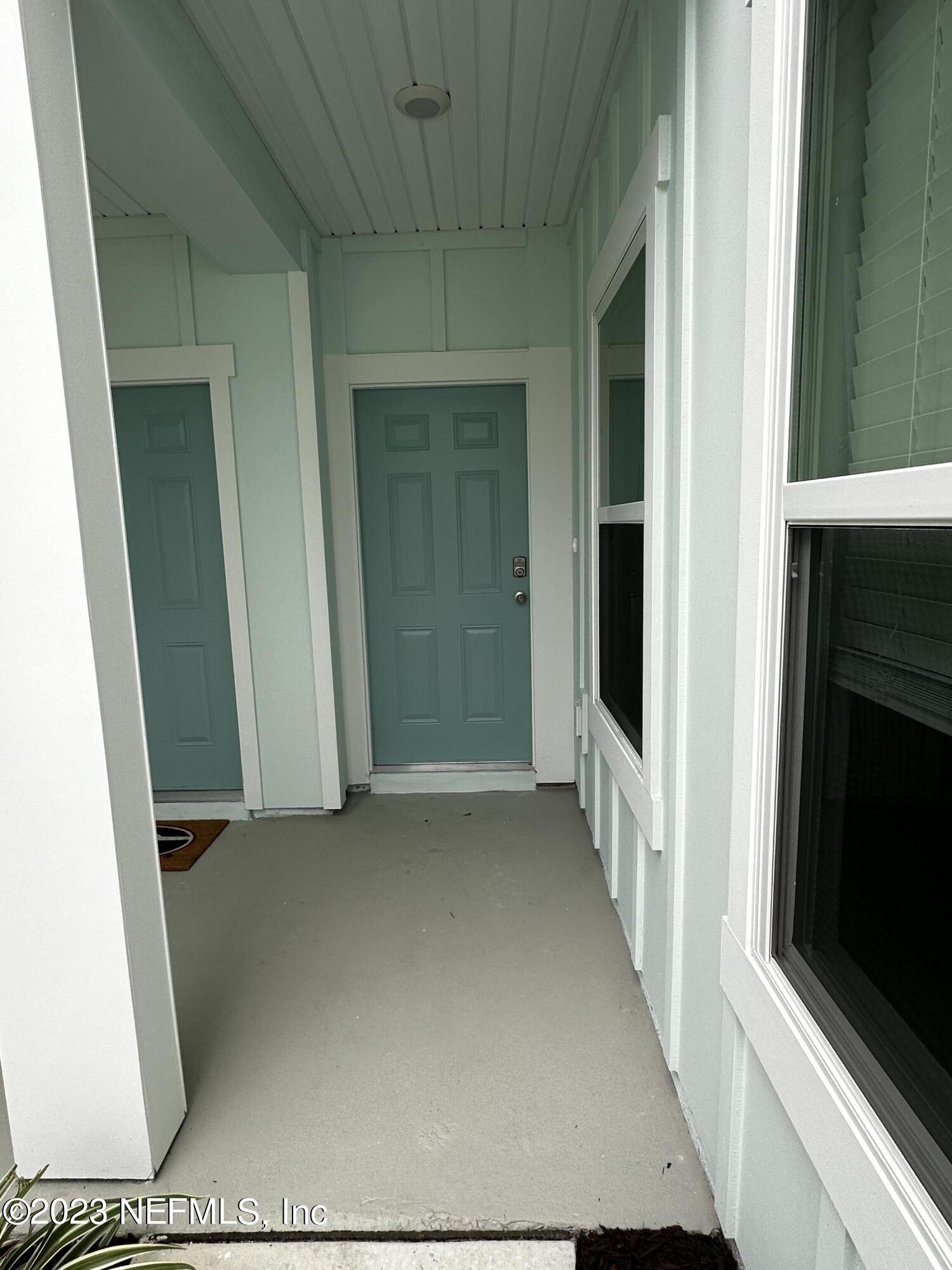 409 Talulla Trail St. Augustine, FL 32095 - Photo 4 of 58 a view of a hallway with wooden floor and staircase