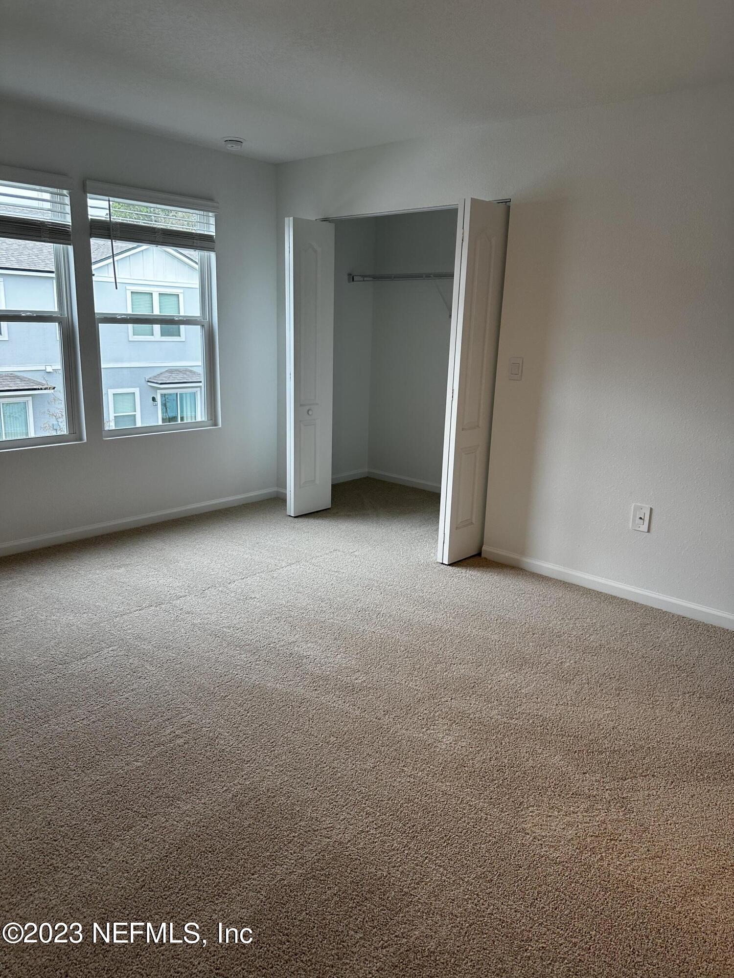 409 Talulla Trail St. Augustine, FL 32095 - Photo 43 of 58 an empty room with windows