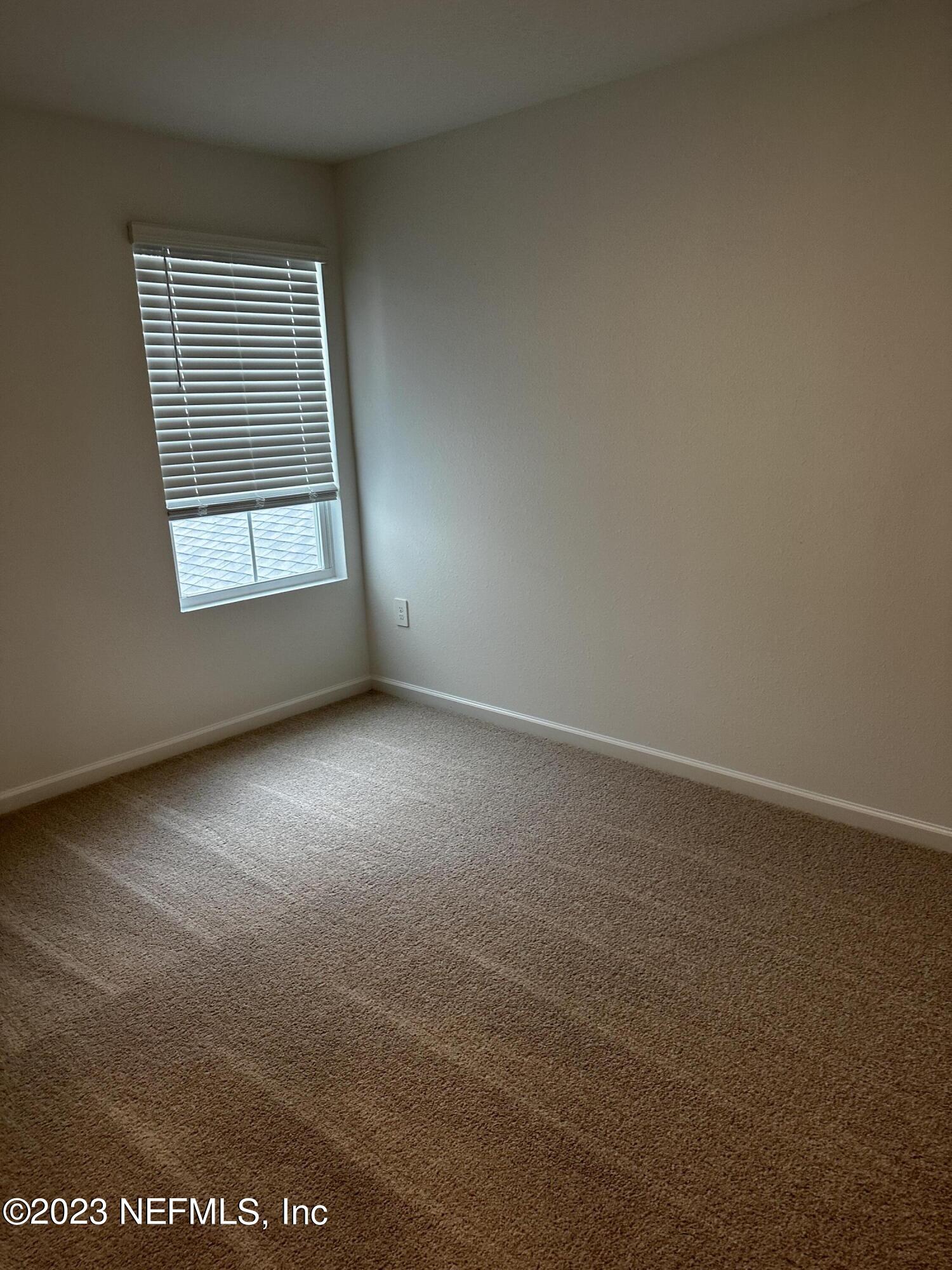 409 Talulla Trail St. Augustine, FL 32095 - Photo 45 of 58 an empty room with windows