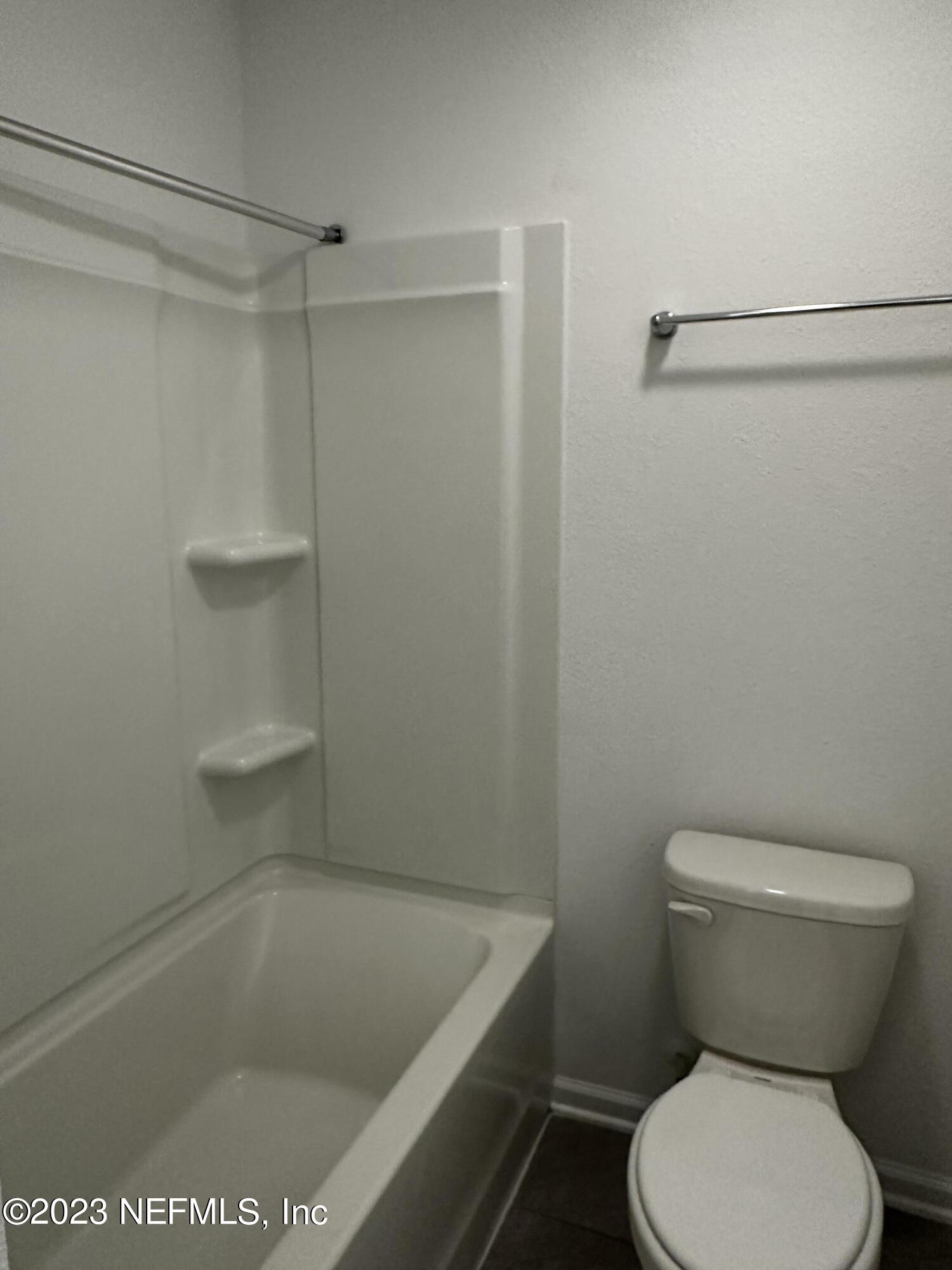 409 Talulla Trail St. Augustine, FL 32095 - Photo 50 of 58 a bathroom with a toilet and a shower