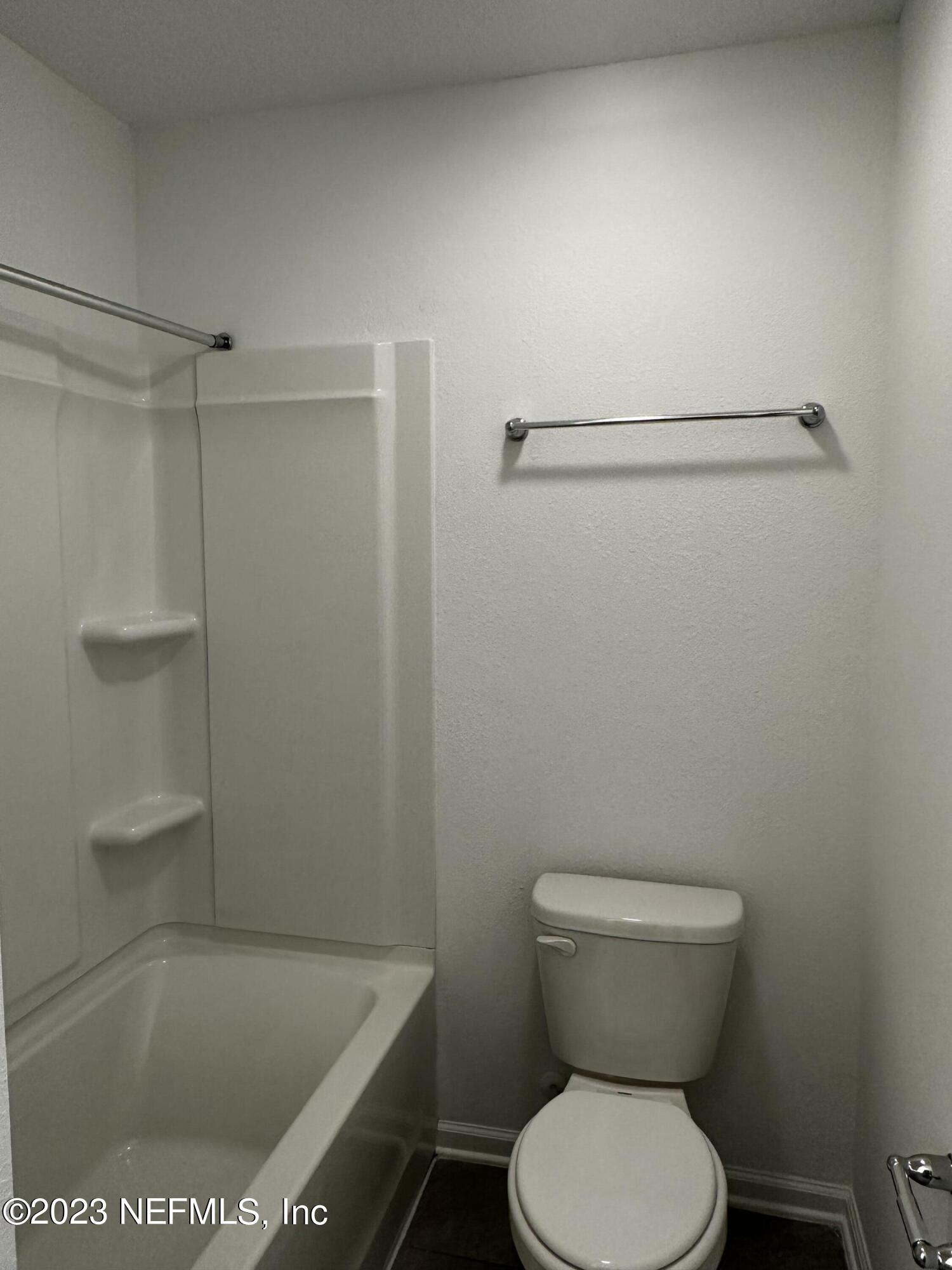 409 Talulla Trail St. Augustine, FL 32095 - Photo 51 of 58 a white toilet sitting next to a bath tub