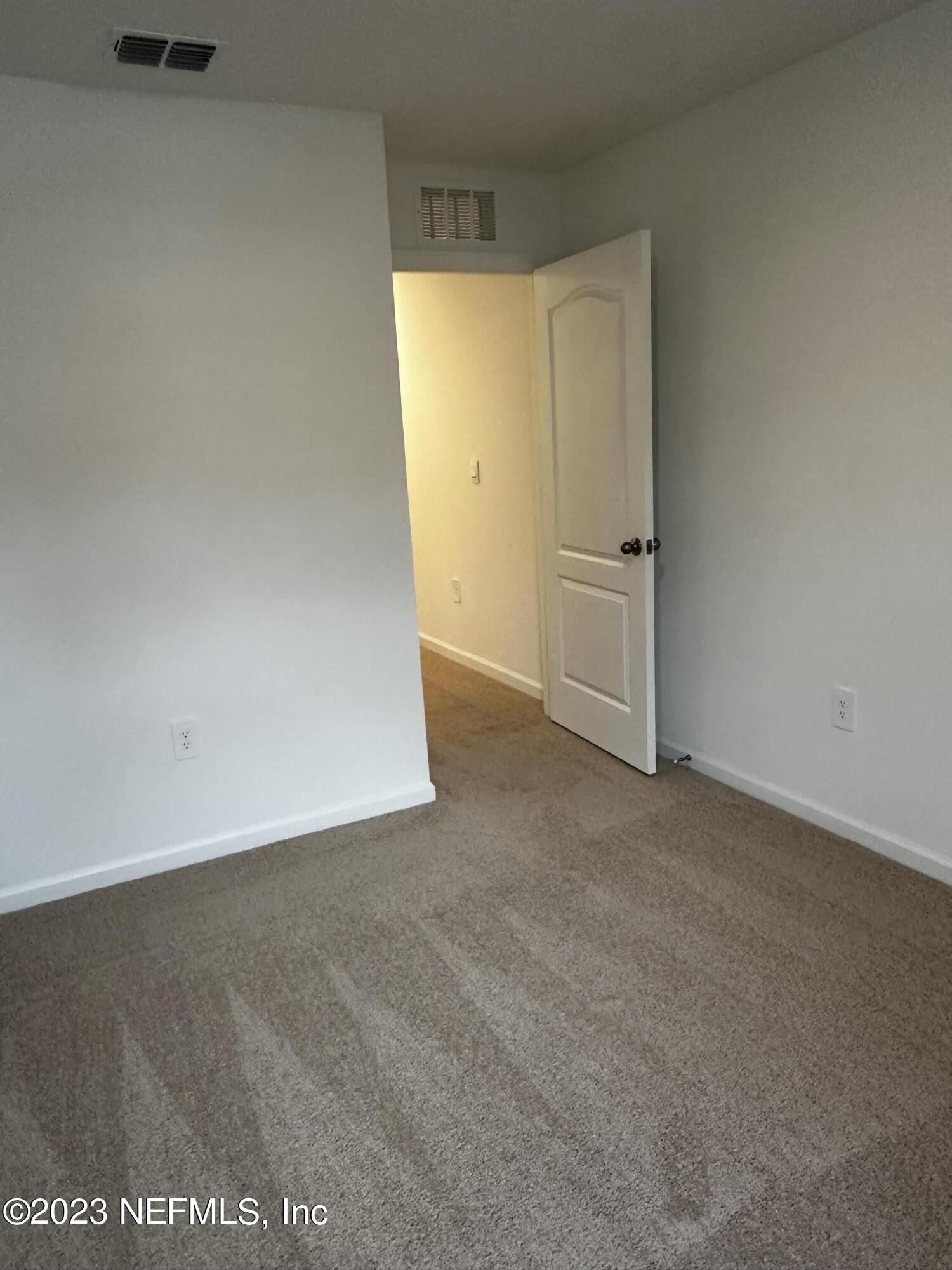 409 Talulla Trail St. Augustine, FL 32095 - Photo 53 of 58 an empty room with windows