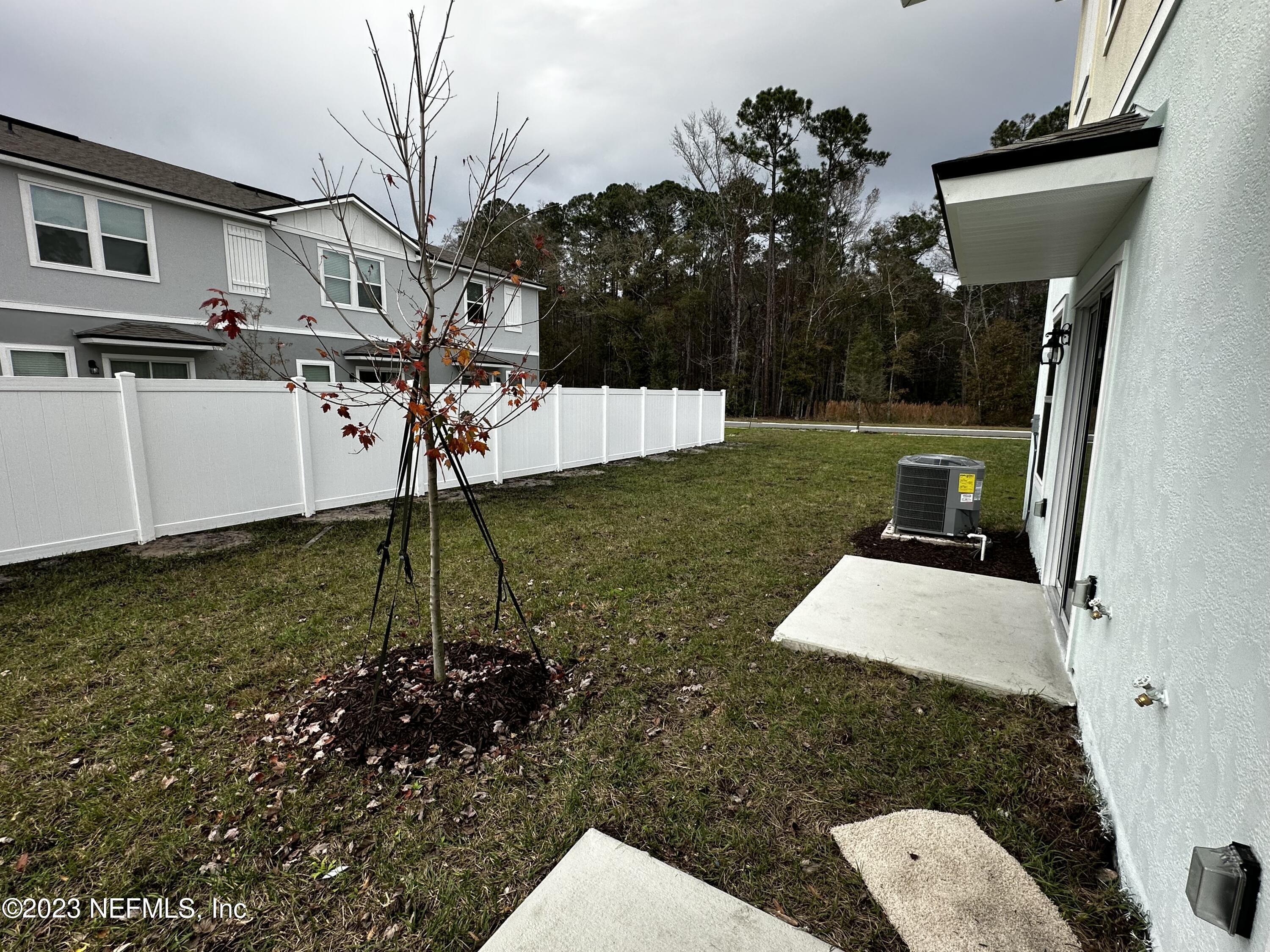 409 Talulla Trail St. Augustine, FL 32095 - Photo 57 of 58 a view of a backyard with sitting area