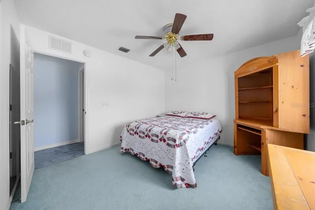 a bedroom with a bed and a cabinets