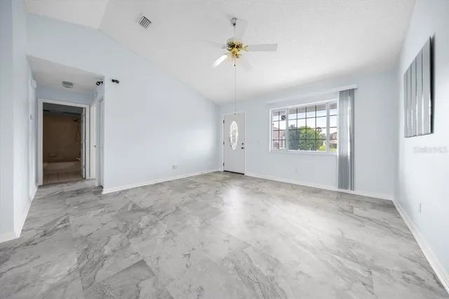 a view of an empty room with a window