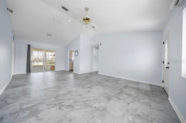 a view of an empty room with a window