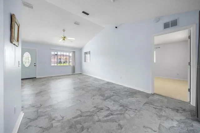 a view of an empty room with a window