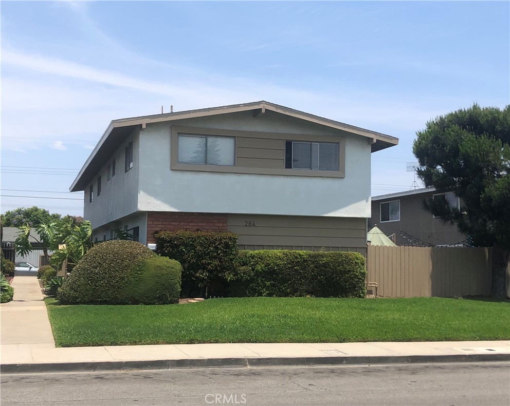 264 Cabrillo Street Costa Mesa, CA 92627 - Photo 1 of 17 a front view of a house with a yard and garage
