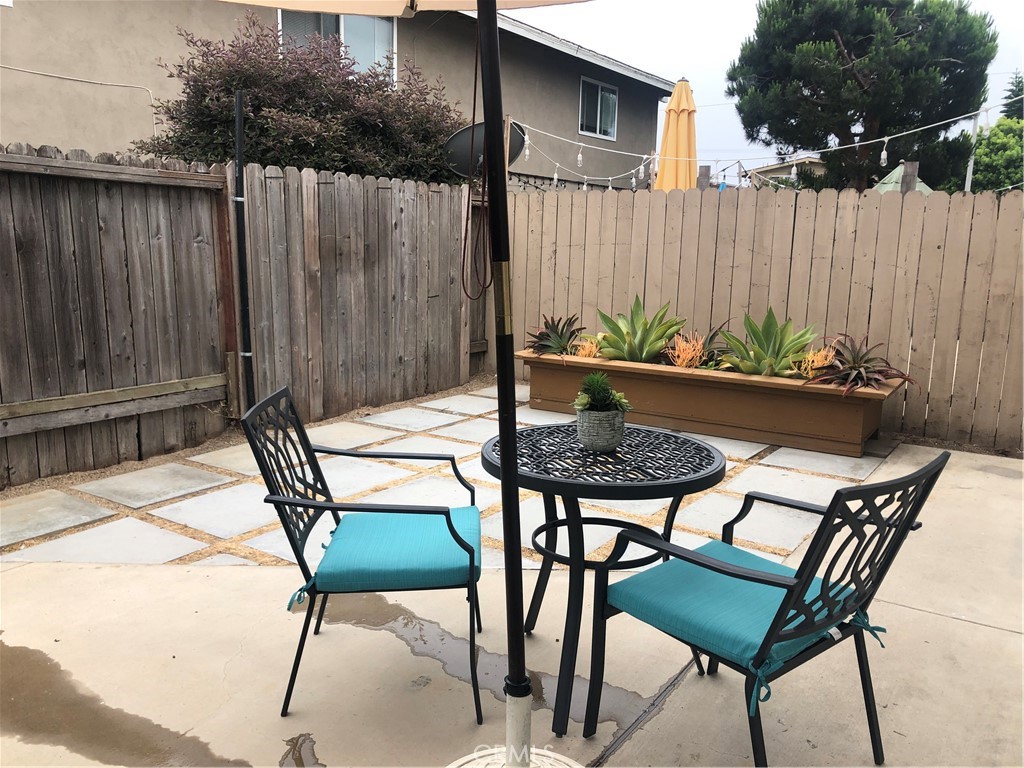 264 Cabrillo Street Costa Mesa, CA 92627 - Photo 13 of 17 a view of a chairs and table in backyard