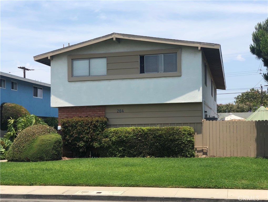 264 Cabrillo Street Costa Mesa, CA 92627 - Photo 16 of 17 a front view of a house with a yard