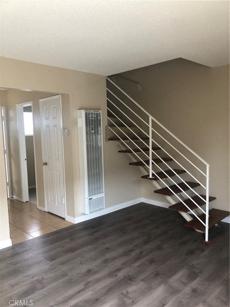 264 Cabrillo Street Costa Mesa, CA 92627 - Photo 6 of 17 a view of a room with wooden floor and stairs