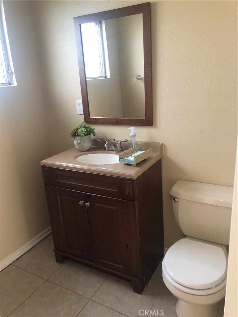 264 Cabrillo Street Costa Mesa, CA 92627 - Photo 9 of 17 a bathroom with a toilet sink and mirror