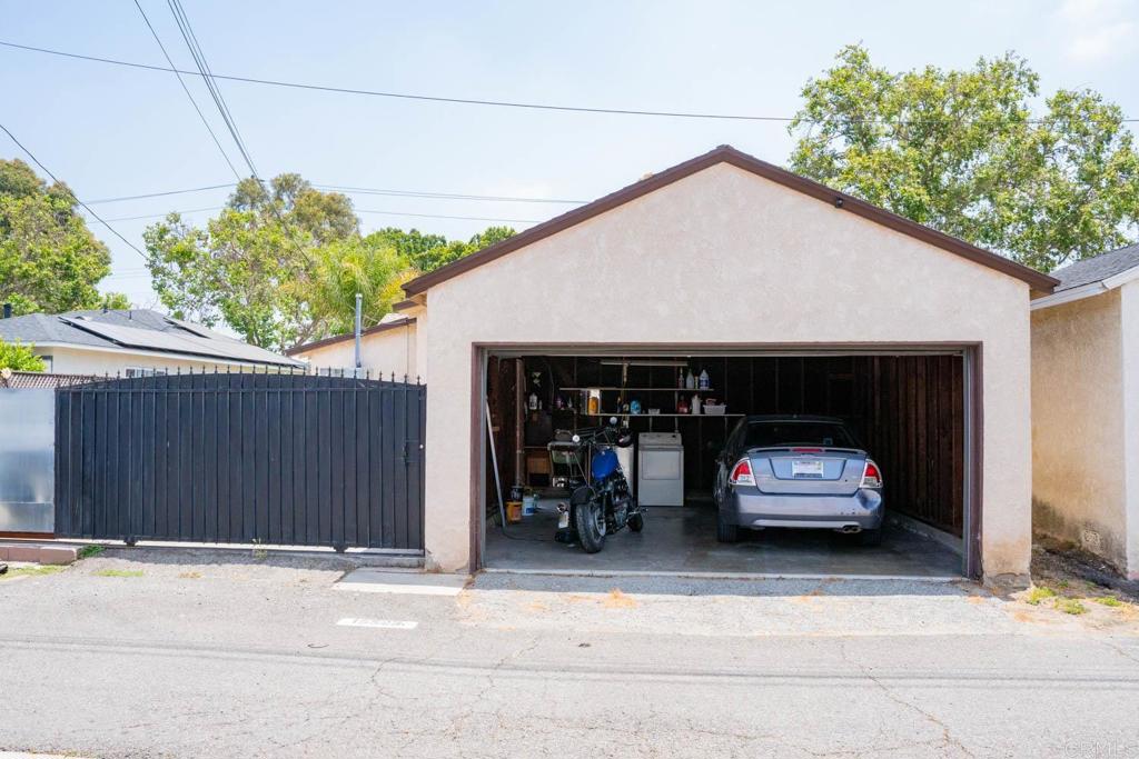 15523 Studebaker Road Norwalk, CA 90650 - Photo 11 of 59 a car parked in front of a house