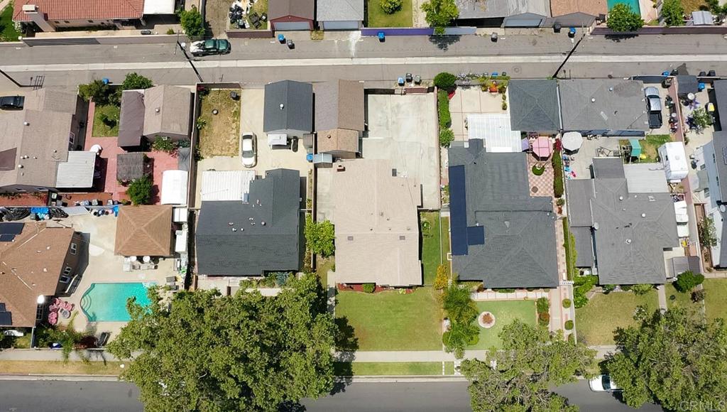 15523 Studebaker Road Norwalk, CA 90650 - Photo 15 of 59 an aerial view of a residential apartment building with yard and parking