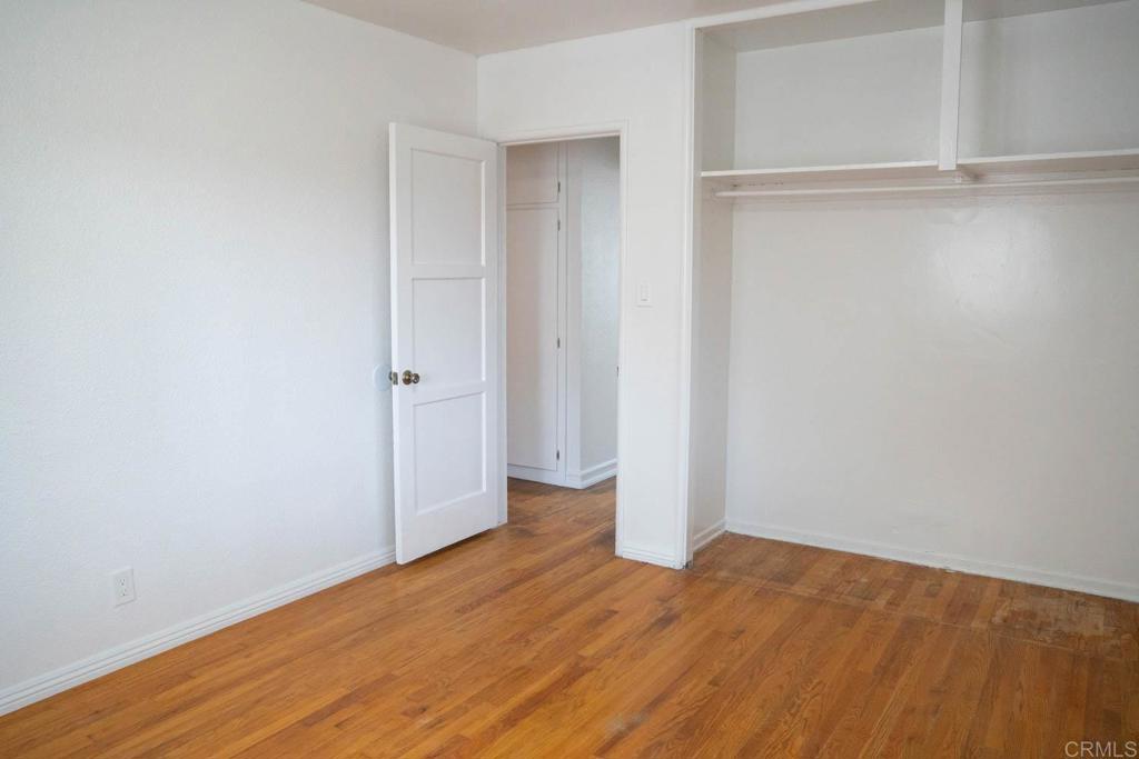 15523 Studebaker Road Norwalk, CA 90650 - Photo 18 of 59 a view of an empty room with wooden floor and closet