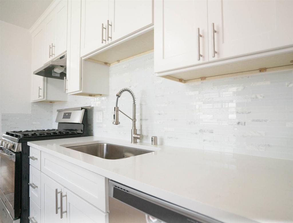 15523 Studebaker Road Norwalk, CA 90650 - Photo 2 of 59 a kitchen with stainless steel appliances a sink a stove and white cabinets