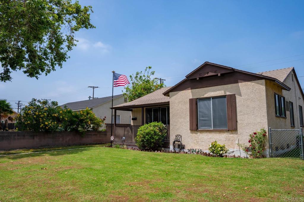 15523 Studebaker Road Norwalk, CA 90650 - Photo 21 of 59 a front view of a house with a yard
