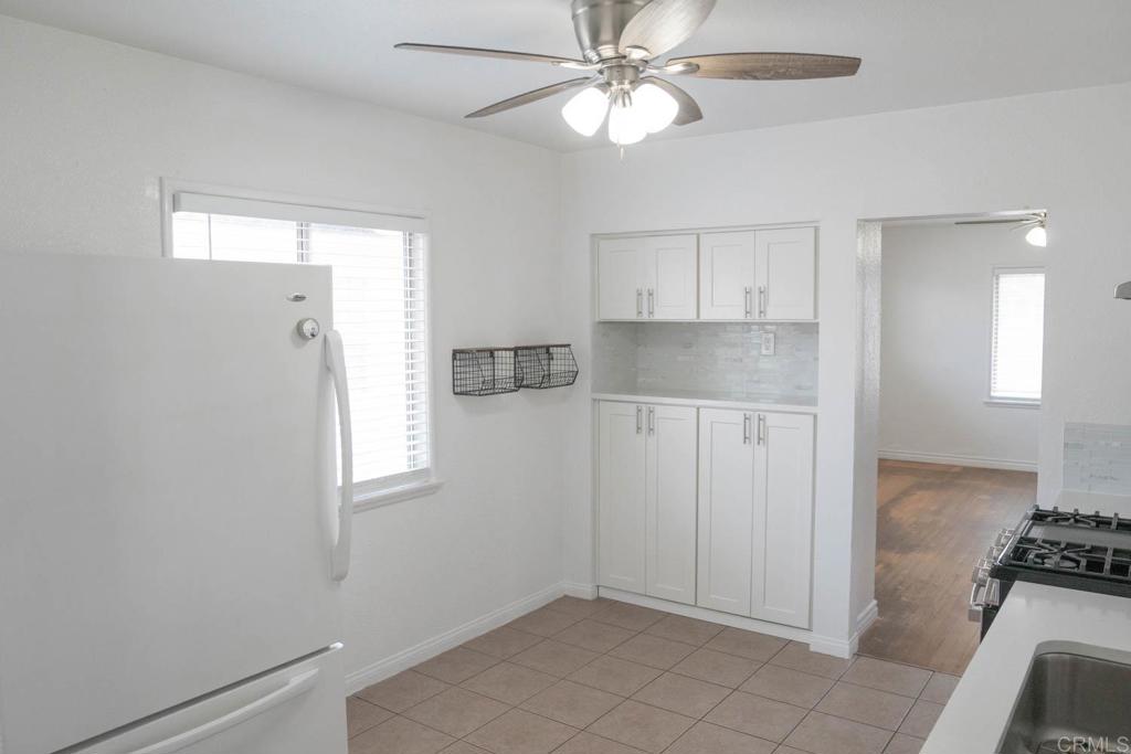 15523 Studebaker Road Norwalk, CA 90650 - Photo 29 of 59 wooden floor in an empty room with a window