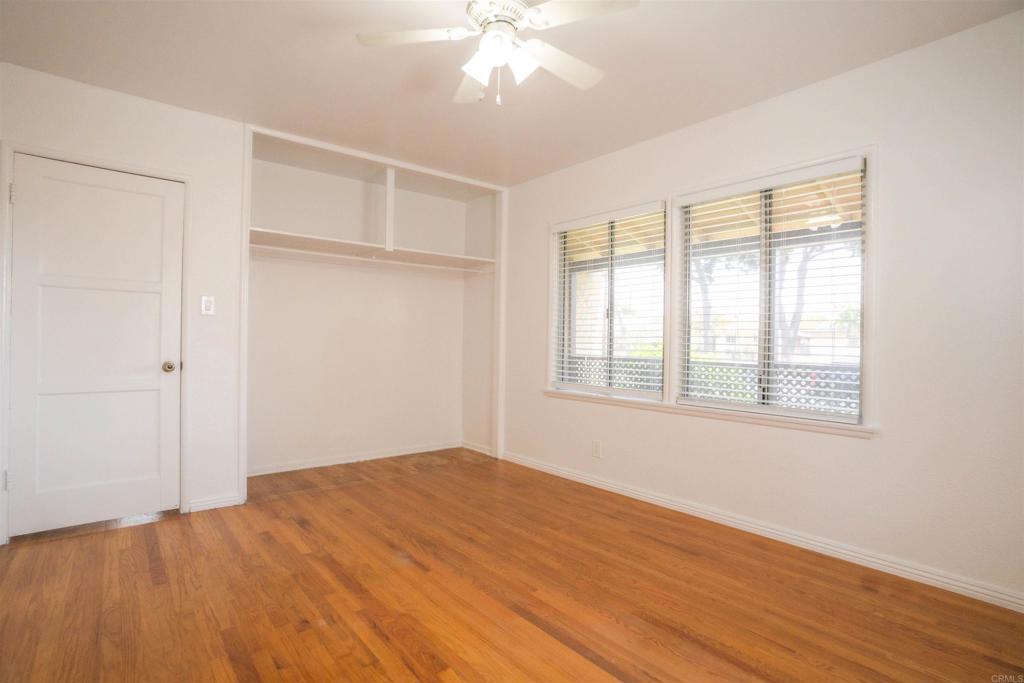 15523 Studebaker Road Norwalk, CA 90650 - Photo 39 of 59 a view of an empty room with wooden floor and a window