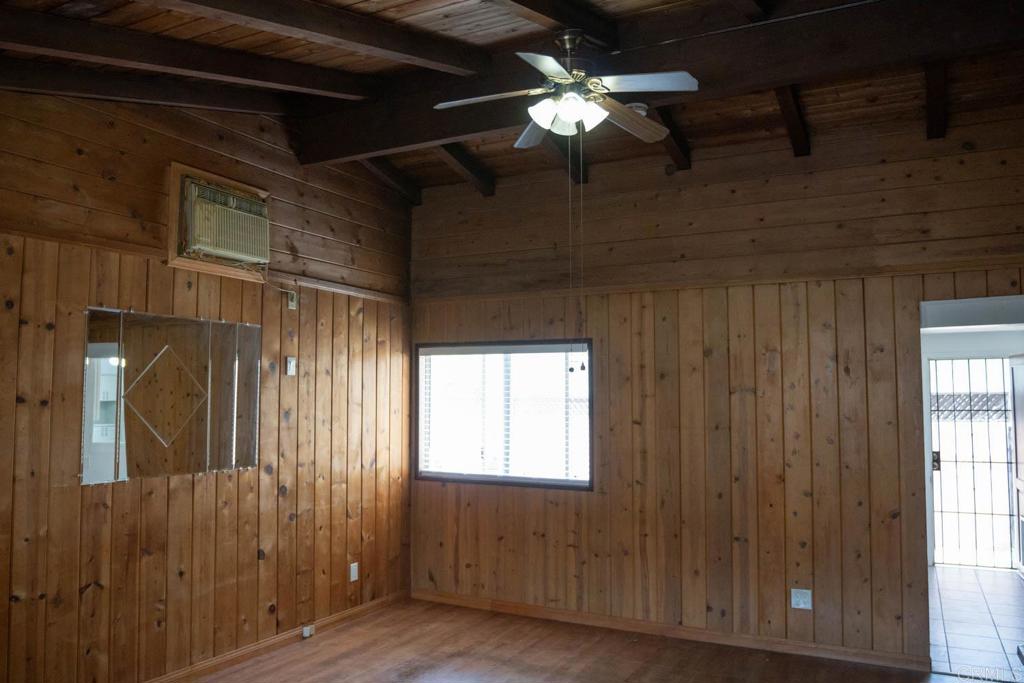 15523 Studebaker Road Norwalk, CA 90650 - Photo 42 of 59 a view of a livingroom with a ceiling fan and window