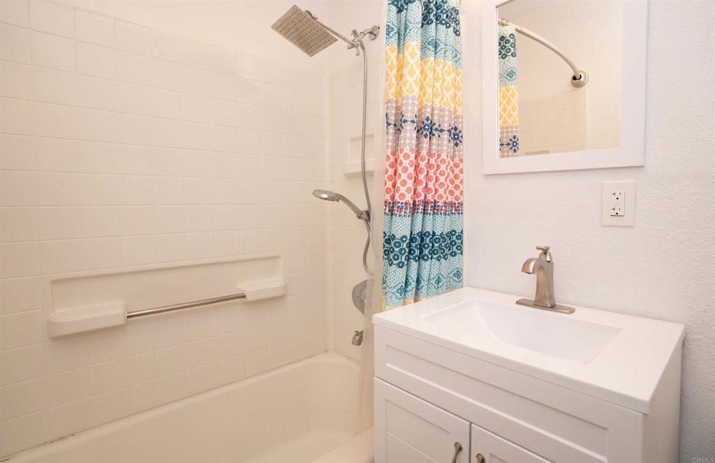 15523 Studebaker Road Norwalk, CA 90650 - Photo 45 of 59 a bathroom with a sink and a mirror