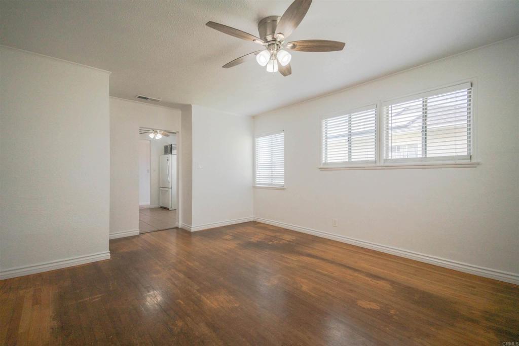 15523 Studebaker Road Norwalk, CA 90650 - Photo 55 of 59 an empty room with windows and fan