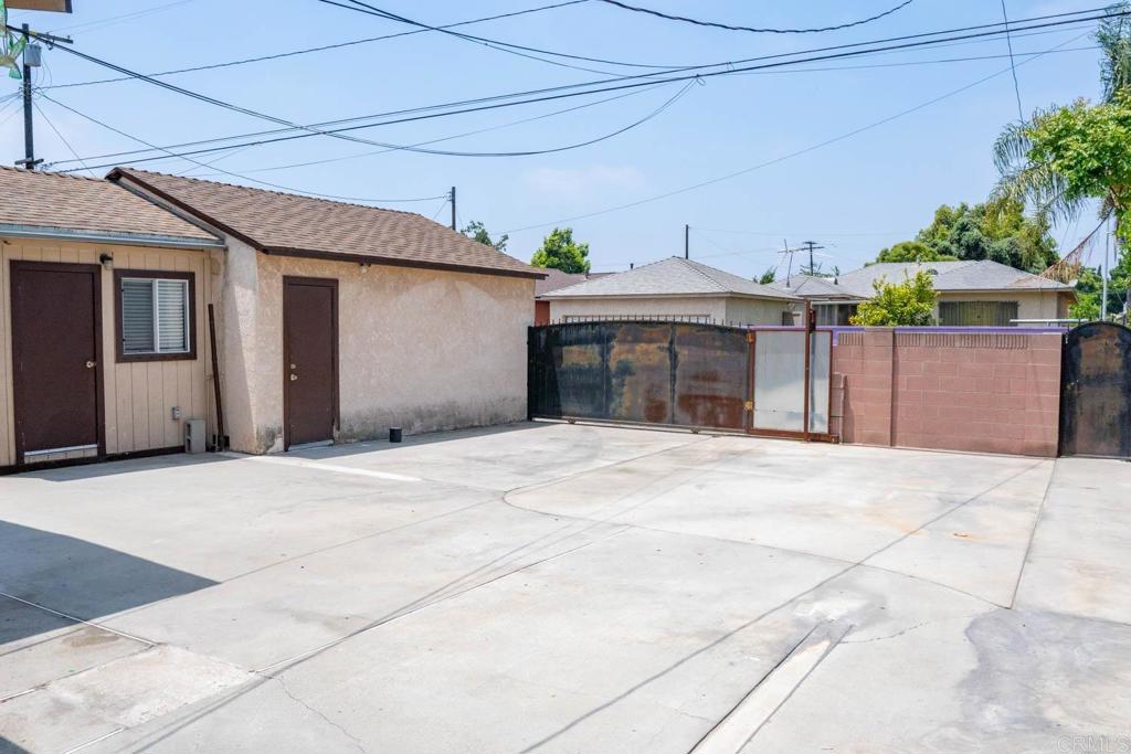15523 Studebaker Road Norwalk, CA 90650 - Photo 9 of 59 a view of a house with a outdoor space and a garage